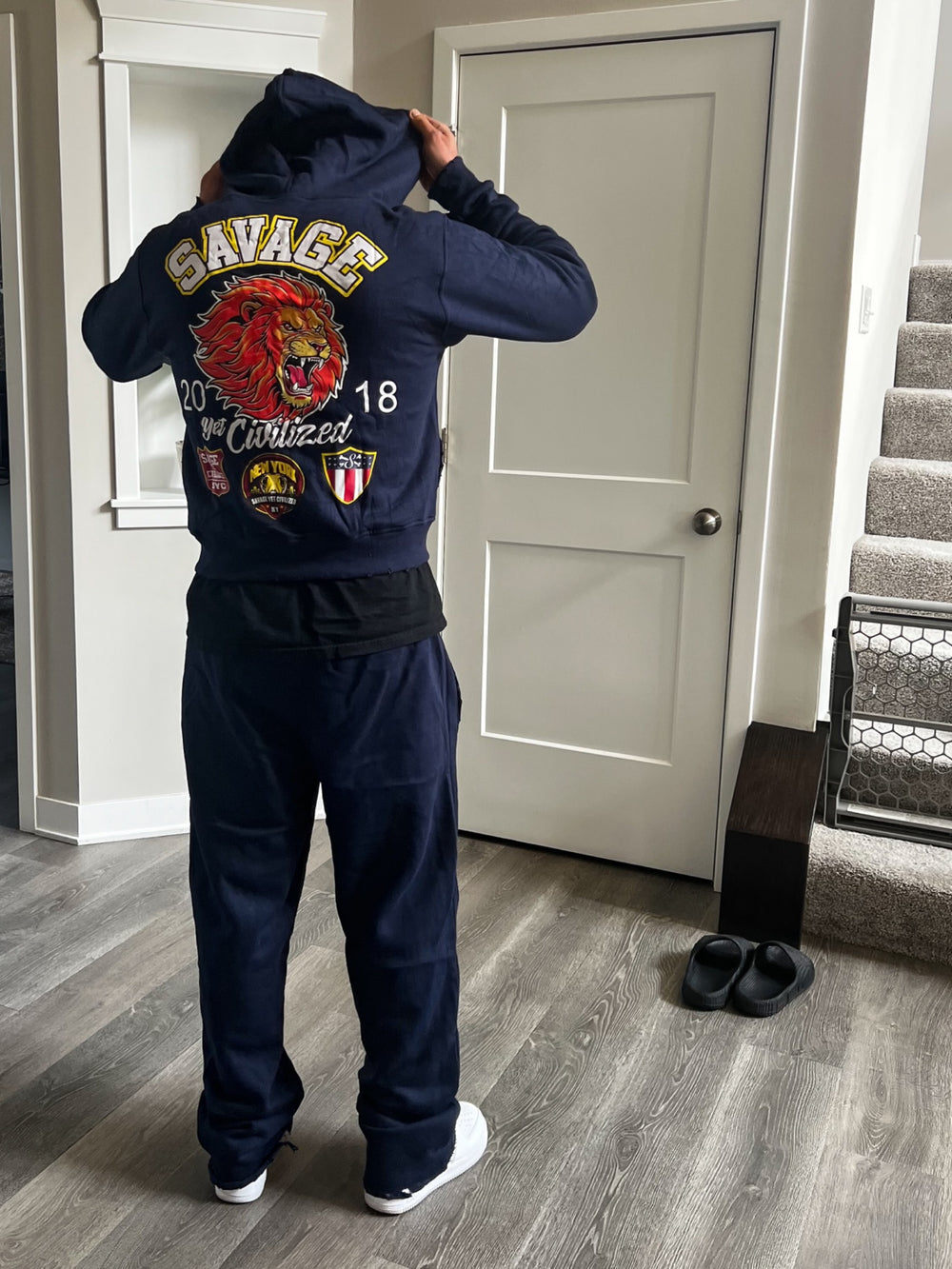 NY hoodie back Savage Yet Civilized lion artwork