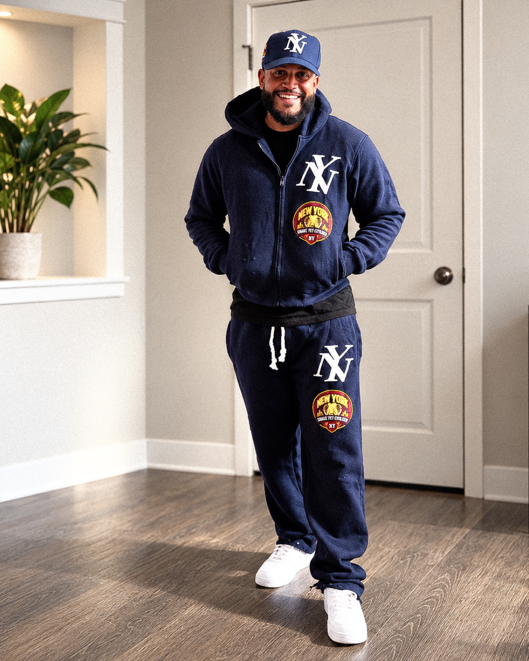 NY straight-leg joggers styled on man; hoodie sold separately